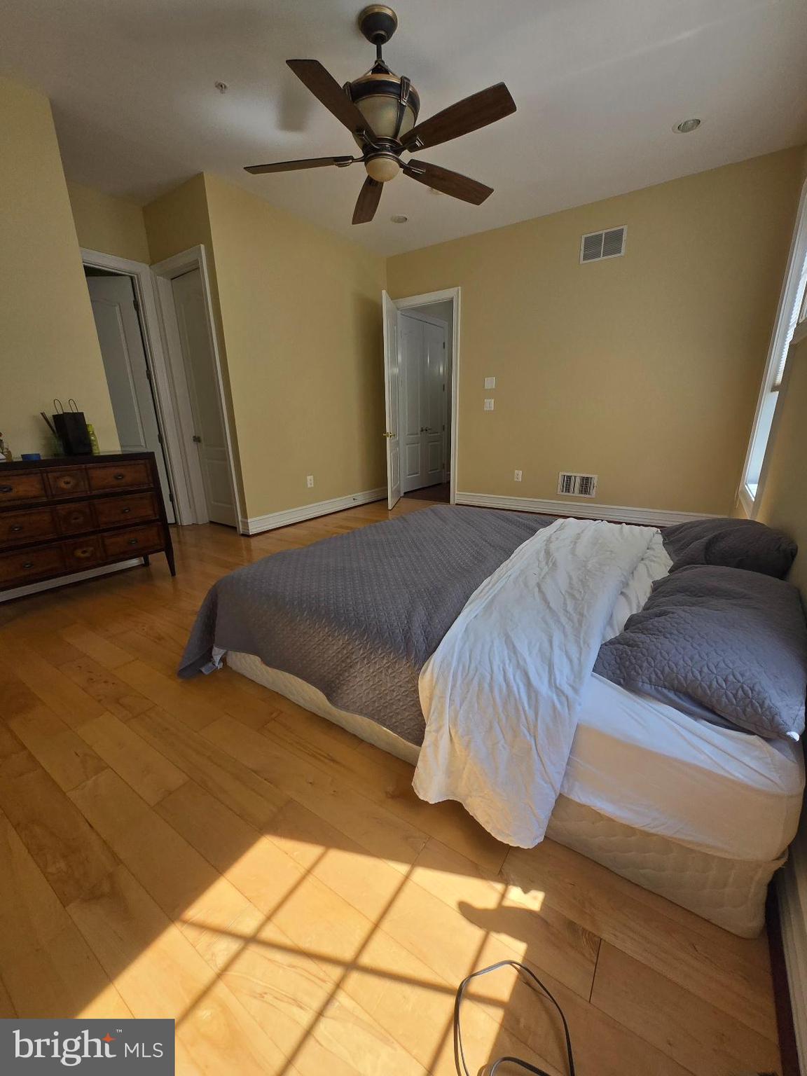 7145 Brooks Road Highland, MD 20777 - Photo 51 of 89 a bedroom with a bed and a mirror