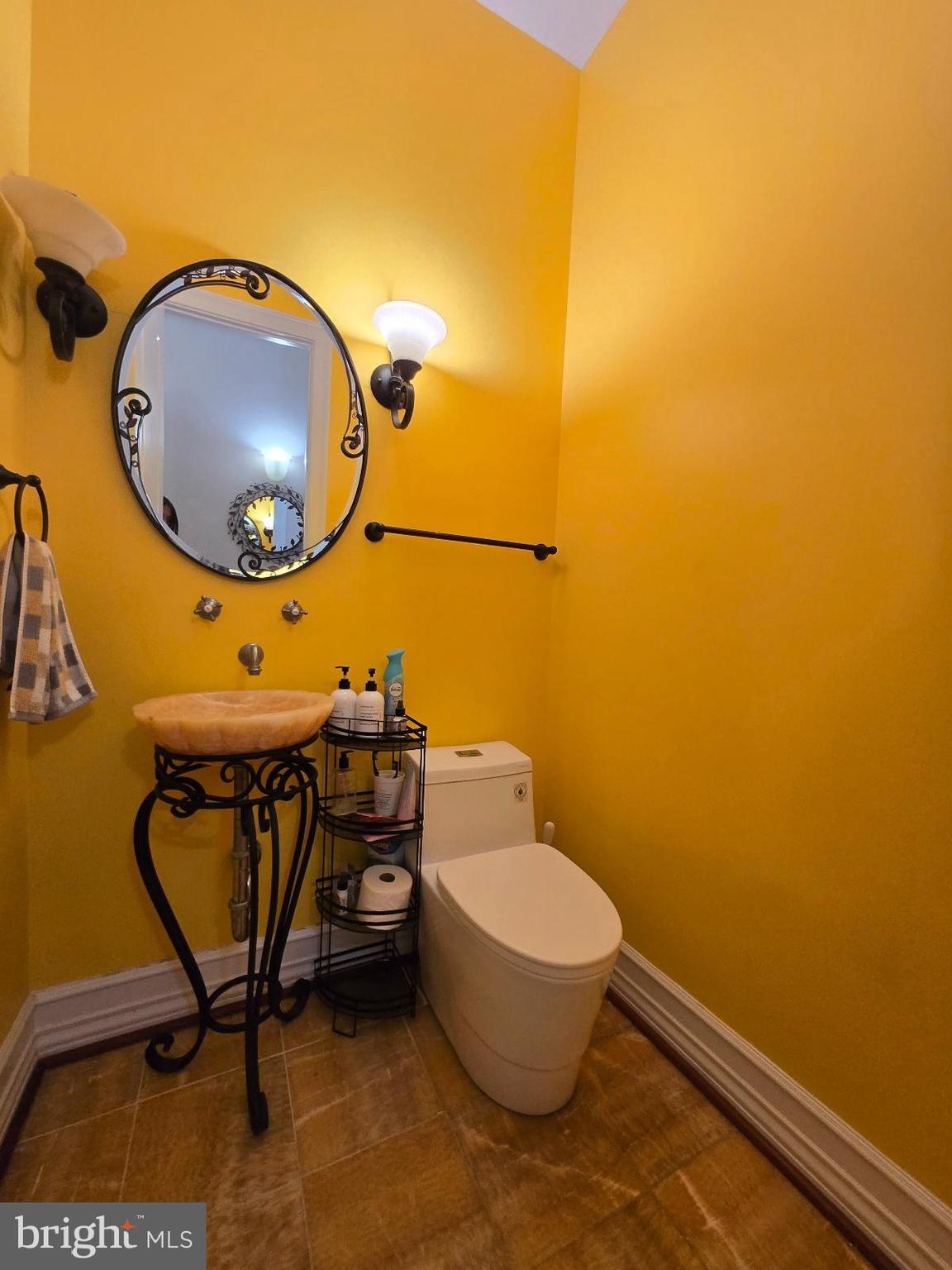 7145 Brooks Road Highland, MD 20777 - Photo 57 of 89 a bathroom with a sink mirror and toilet
