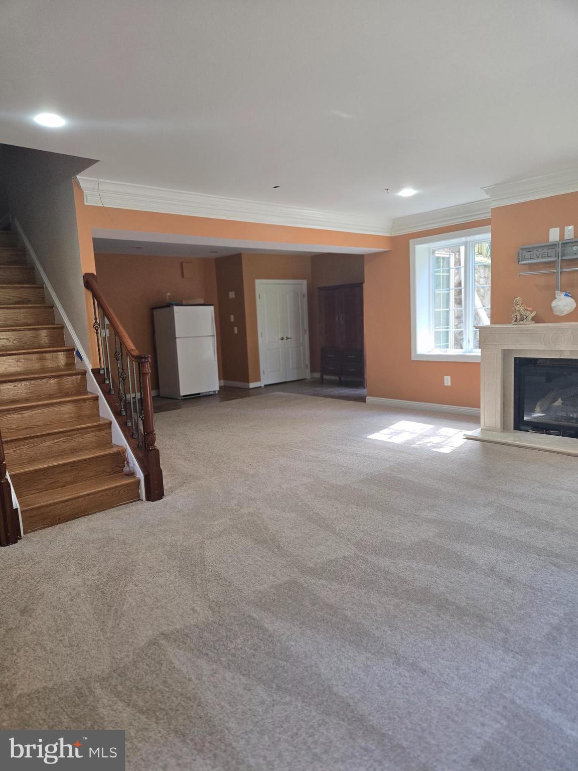 7145 Brooks Road Highland, MD 20777 - Photo 63 of 89 a view of a livingroom with an empty space and a fireplace
