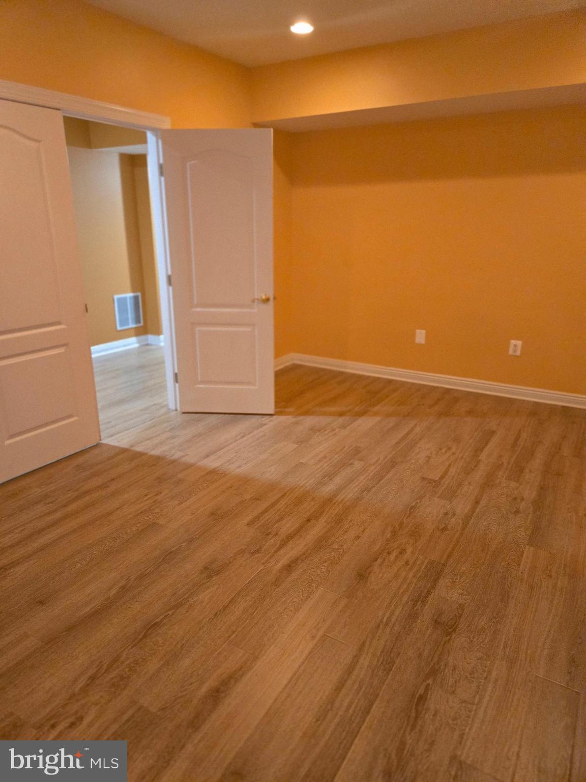7145 Brooks Road Highland, MD 20777 - Photo 74 of 89 a view of an empty room with wooden floor