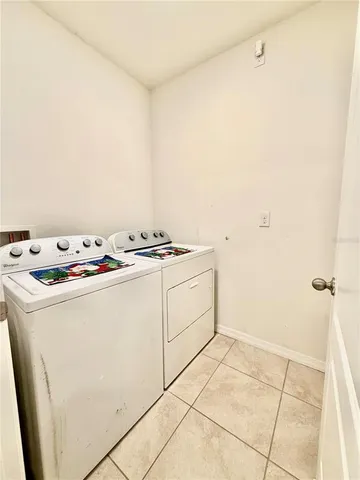 a utility room with washer and dryer