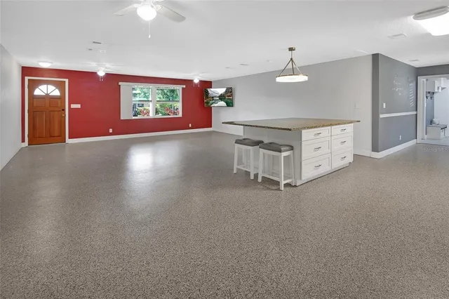 a kitchen with a refrigerator and cabinets