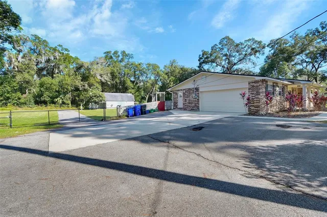 an aerial view of a house with a swimming pool