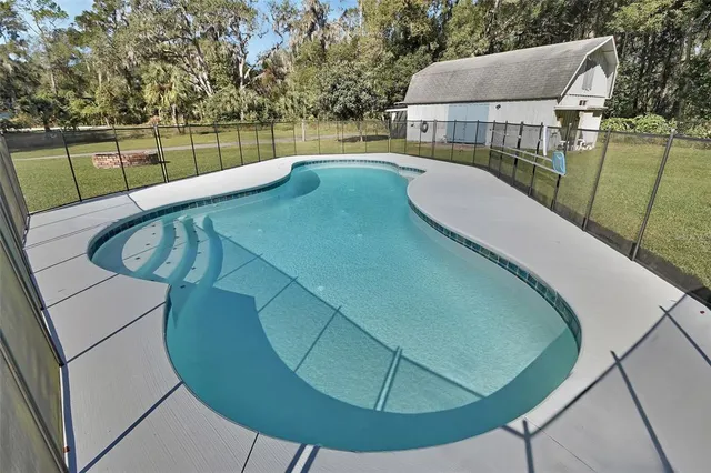 a view of a swimming pool with a balcony