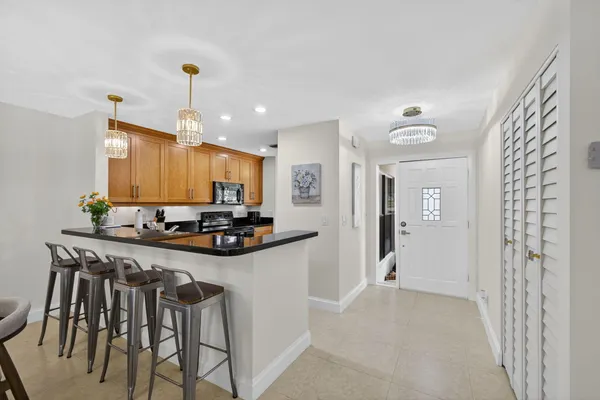 a view of a dining room and a table and chairs