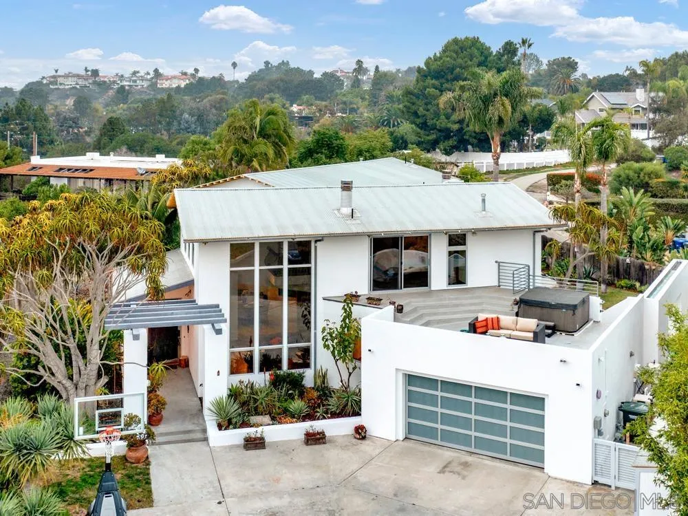 778 Ramona Place Del Mar, CA 92014 - Photo 1 of 72 a view of a white house with large windows and a small yard