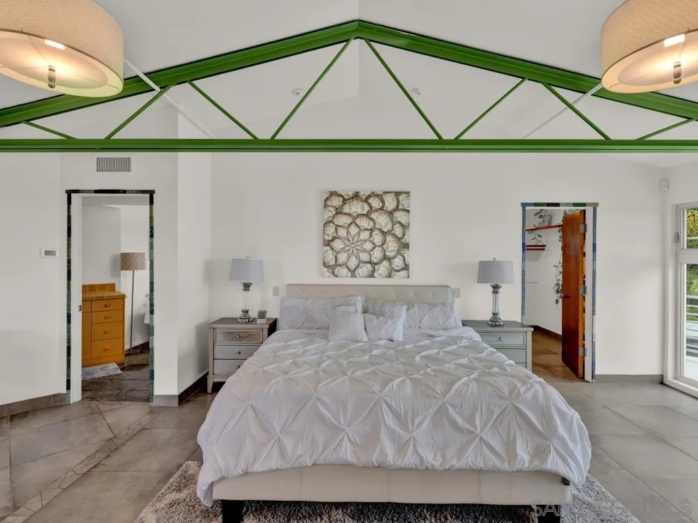 778 Ramona Place Del Mar, CA 92014 - Photo 22 of 72 a bedroom with a bed and a painting on the wall