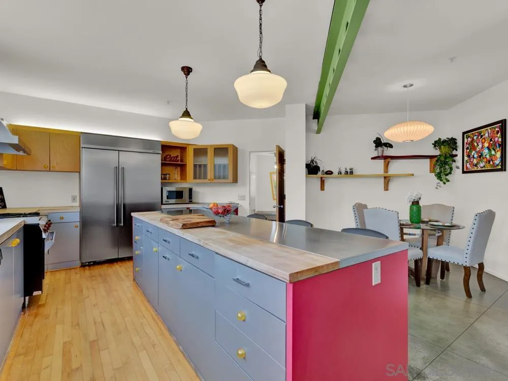 778 Ramona Place Del Mar, CA 92014 - Photo 41 of 72 a kitchen with stainless steel appliances granite countertop a sink a stove and a wooden floors