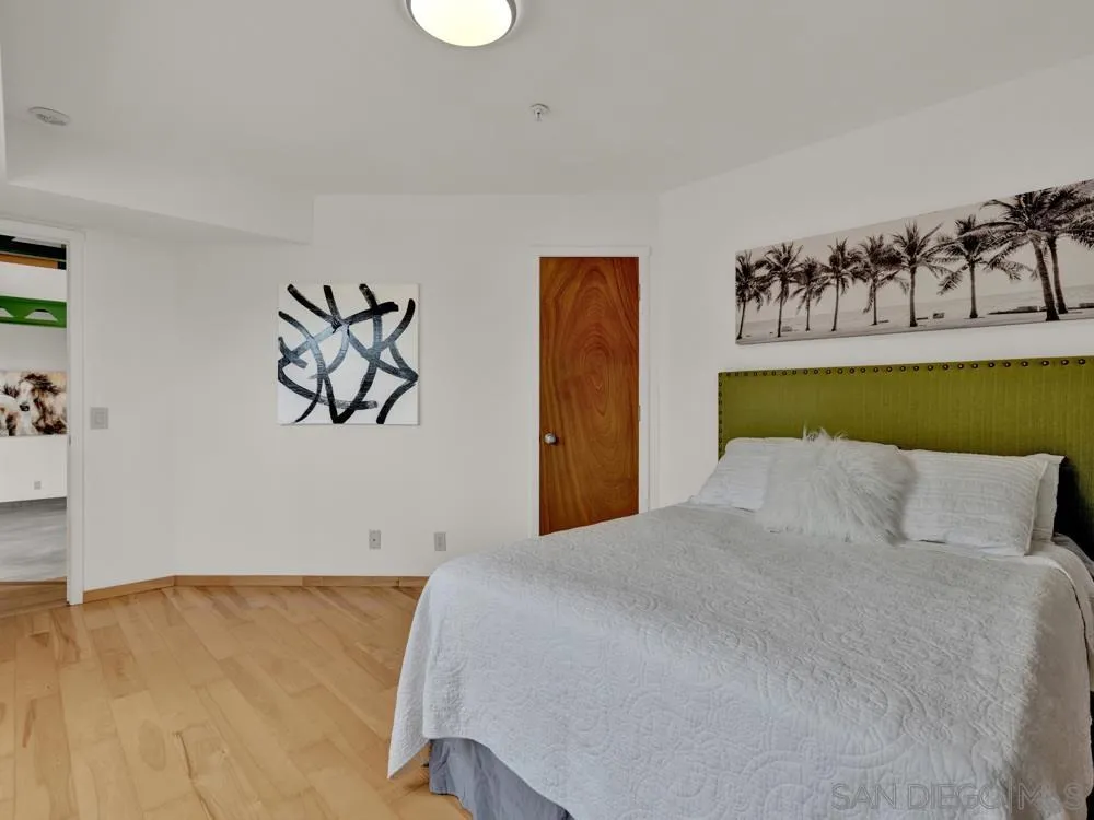 778 Ramona Place Del Mar, CA 92014 - Photo 44 of 72 a bedroom with a bed and wall painting