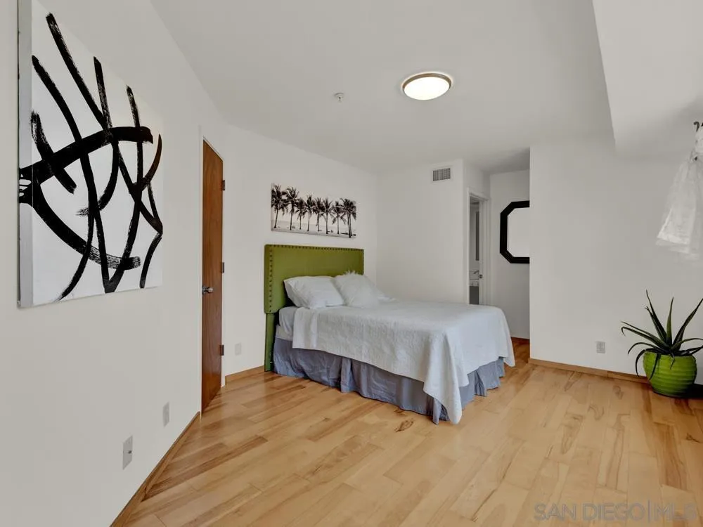 778 Ramona Place Del Mar, CA 92014 - Photo 45 of 72 a bedroom with a bed and a potted plant on the wall