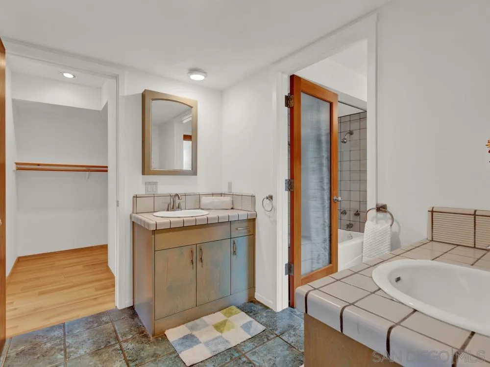 778 Ramona Place Del Mar, CA 92014 - Photo 46 of 72 a bathroom with a tub sink and mirror