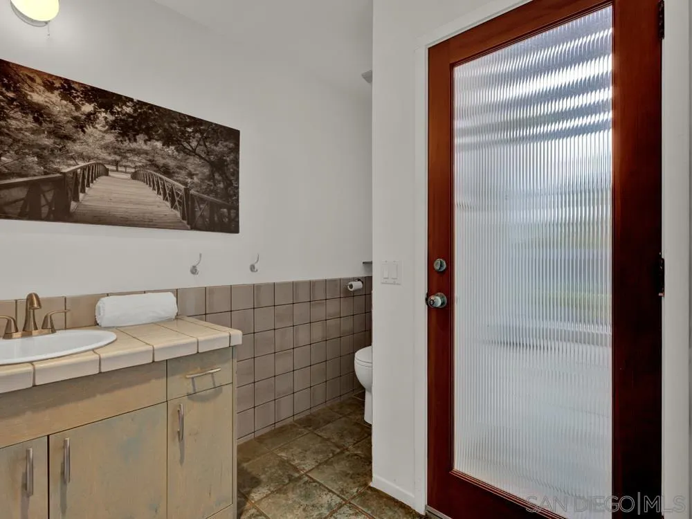 778 Ramona Place Del Mar, CA 92014 - Photo 48 of 72 a bathroom with a sink and a mirror