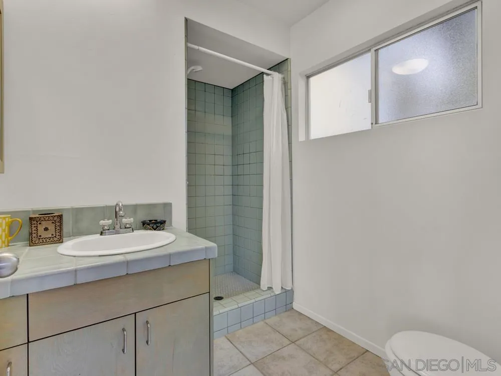 778 Ramona Place Del Mar, CA 92014 - Photo 59 of 72 a bathroom with a sink a toilet and vanity