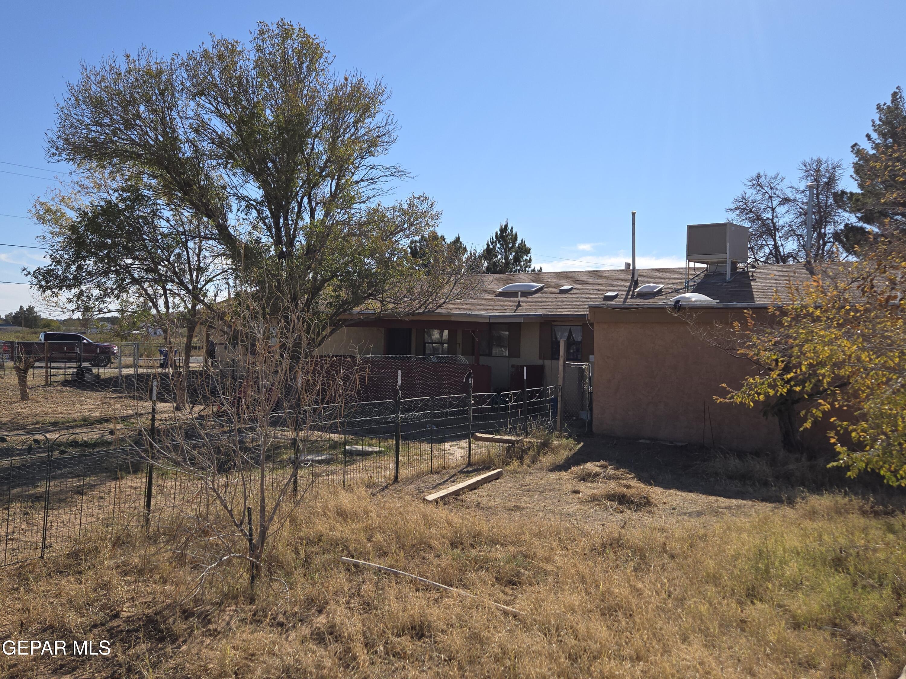 625 Tumbleweed Road Chaparral, NM 88081 - Photo 7 of 17 a view of backyard with a table and chairs