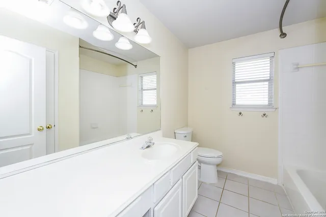 a white bath tub sitting next to a window