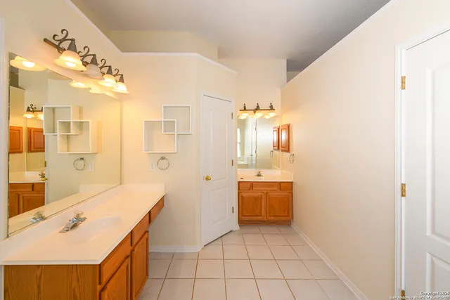 a bathroom with a bathtub a shower and a sink