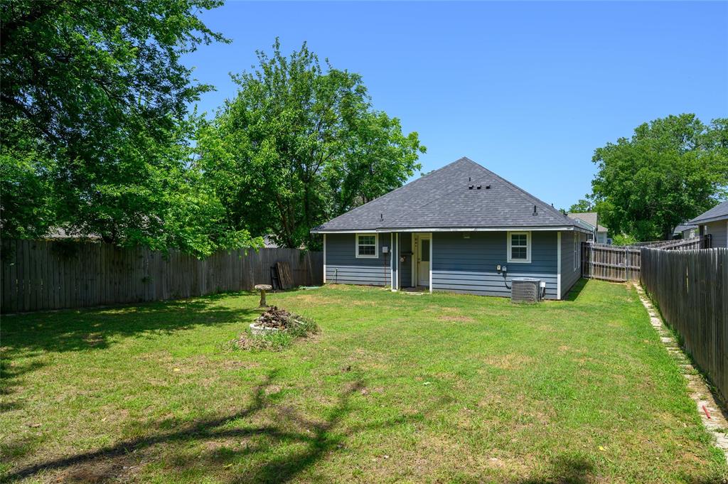 318 Munson Street Denison, TX 75021 - Photo 19 of 21 a front view of a house with garden