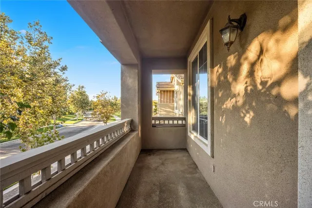 a view of a balcony with wooden floor