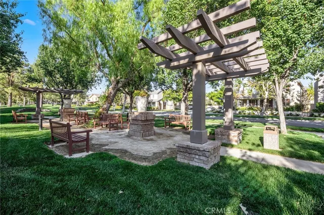 a view of a chair and table in the garden