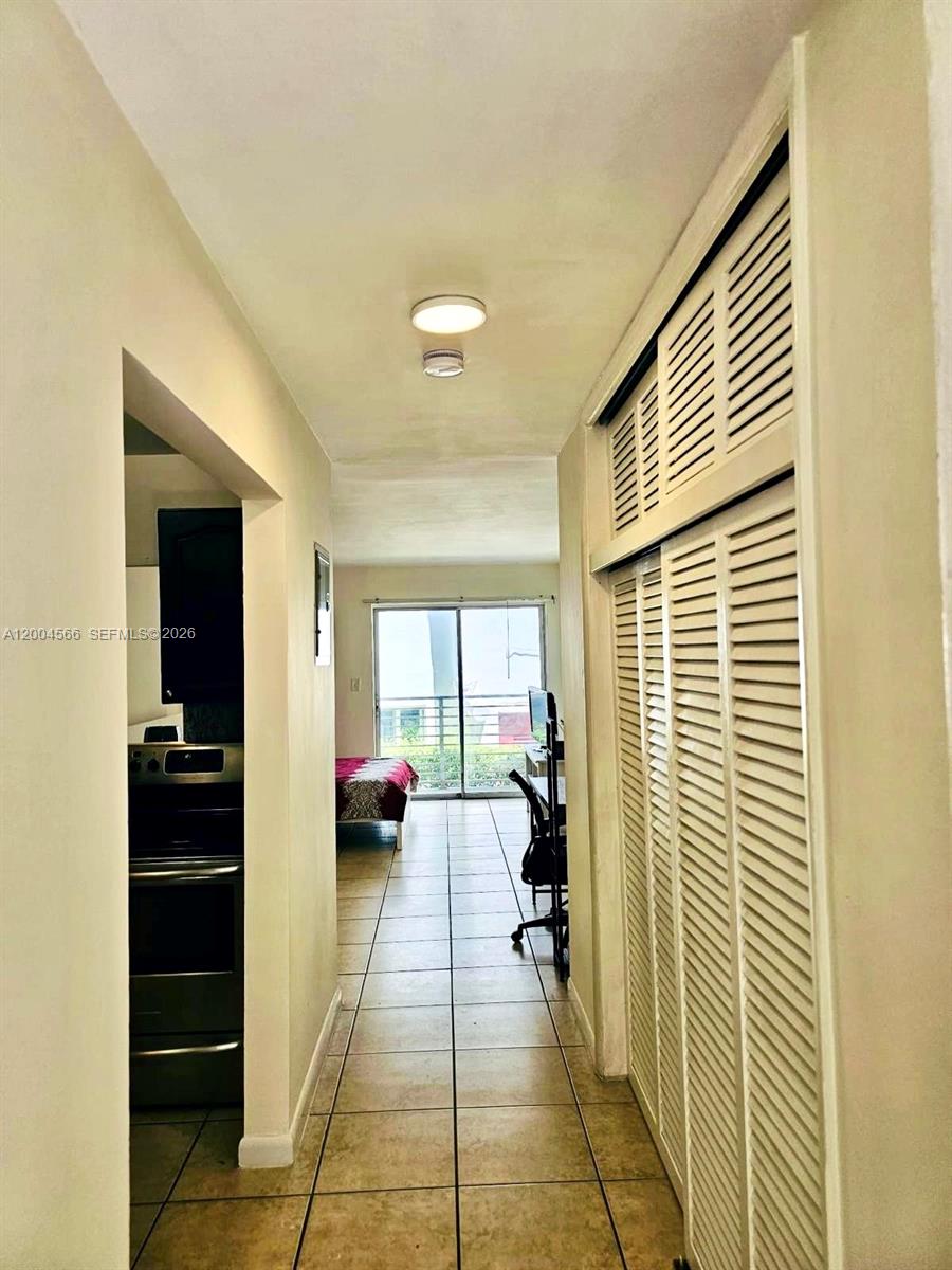 1441 Lincoln Road, Unit 212 Miami Beach, FL 33139 - Photo 5 of 9 a living room with furniture