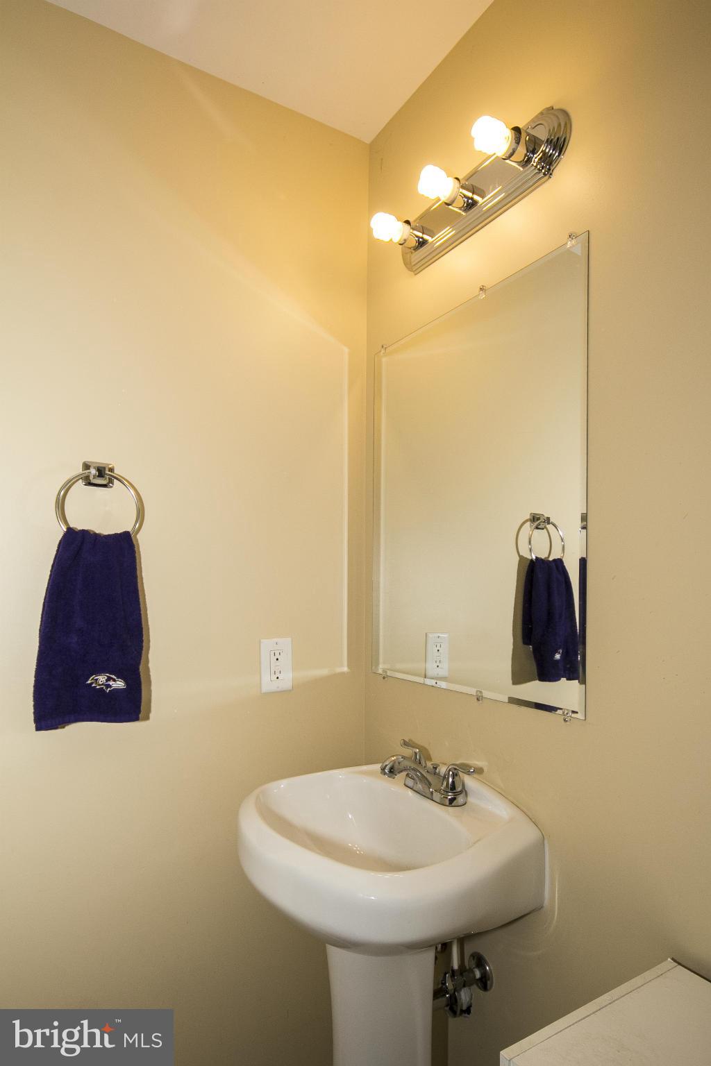 1908 Cherry Place Edgewood, MD 21040 - Photo 22 of 28 a bathroom with a sink and a mirror