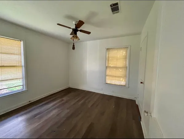 a view of an empty room and a window