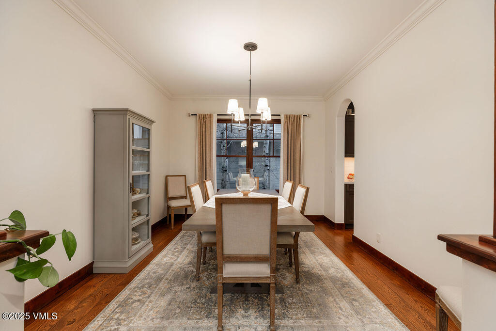 170 Palmer Loop Eagle, CO 81631 - Photo 11 of 37 a dining room with furniture a chandelier and wooden floor