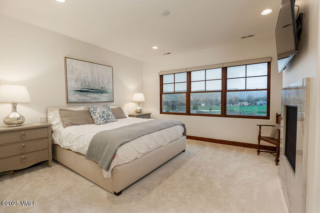 170 Palmer Loop Eagle, CO 81631 - Photo 12 of 37 a bedroom with a large bed and a window