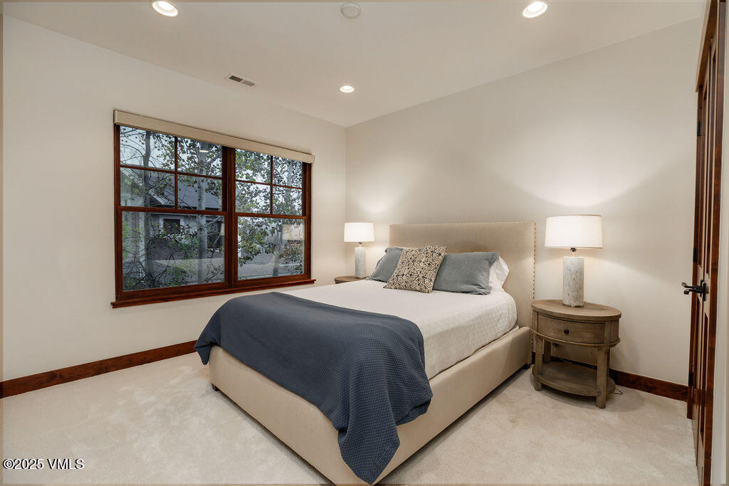 170 Palmer Loop Eagle, CO 81631 - Photo 15 of 37 a bed room with a bed and a large window