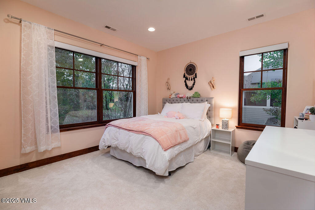 170 Palmer Loop Eagle, CO 81631 - Photo 17 of 37 a bedroom with a bed and a large window