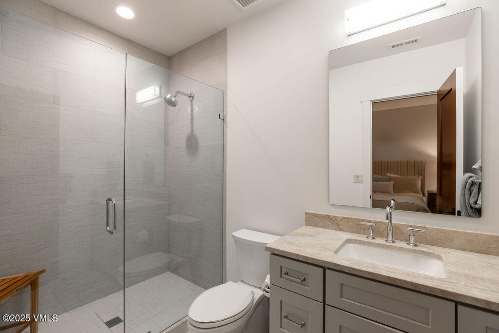 170 Palmer Loop Eagle, CO 81631 - Photo 21 of 37 a bathroom with a granite countertop sink toilet and shower