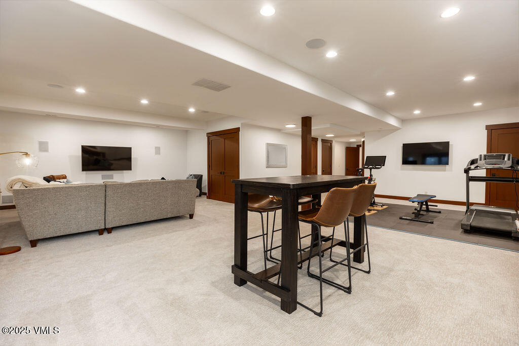 170 Palmer Loop Eagle, CO 81631 - Photo 22 of 37 a living room with furniture and a flat screen tv