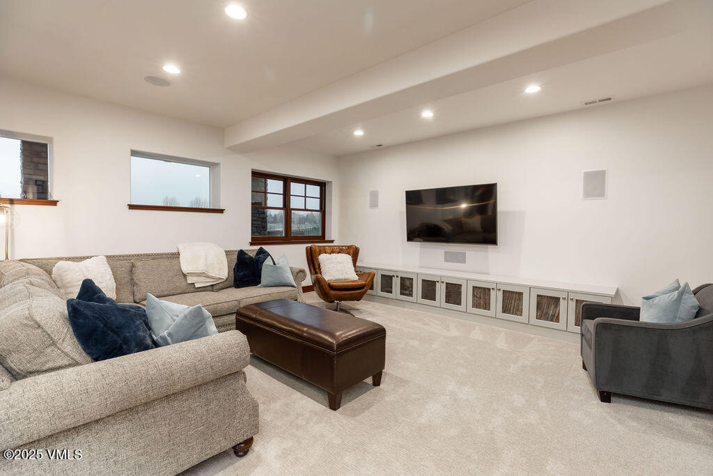 170 Palmer Loop Eagle, CO 81631 - Photo 23 of 37 a living room with furniture and a flat screen tv