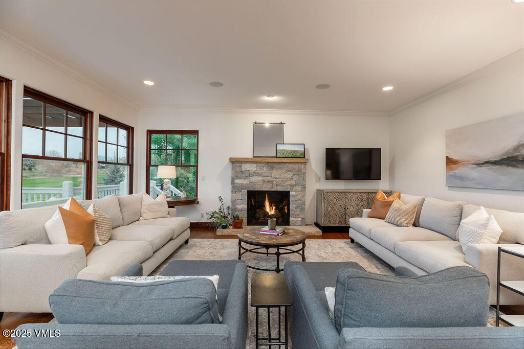 170 Palmer Loop Eagle, CO 81631 - Photo 3 of 37 a living room with furniture large window and a fireplace