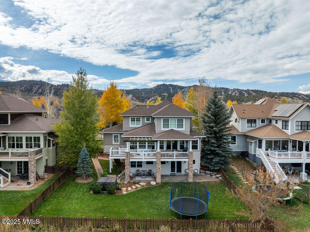 170 Palmer Loop Eagle, CO 81631 - Photo 34 of 37 a view of a white house with a yard table and chairs