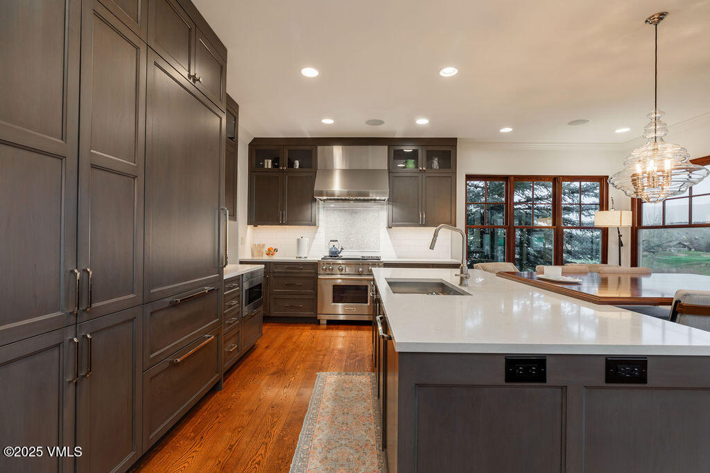 170 Palmer Loop Eagle, CO 81631 - Photo 9 of 37 a kitchen with kitchen island a counter top space a sink stainless steel appliances and cabinets