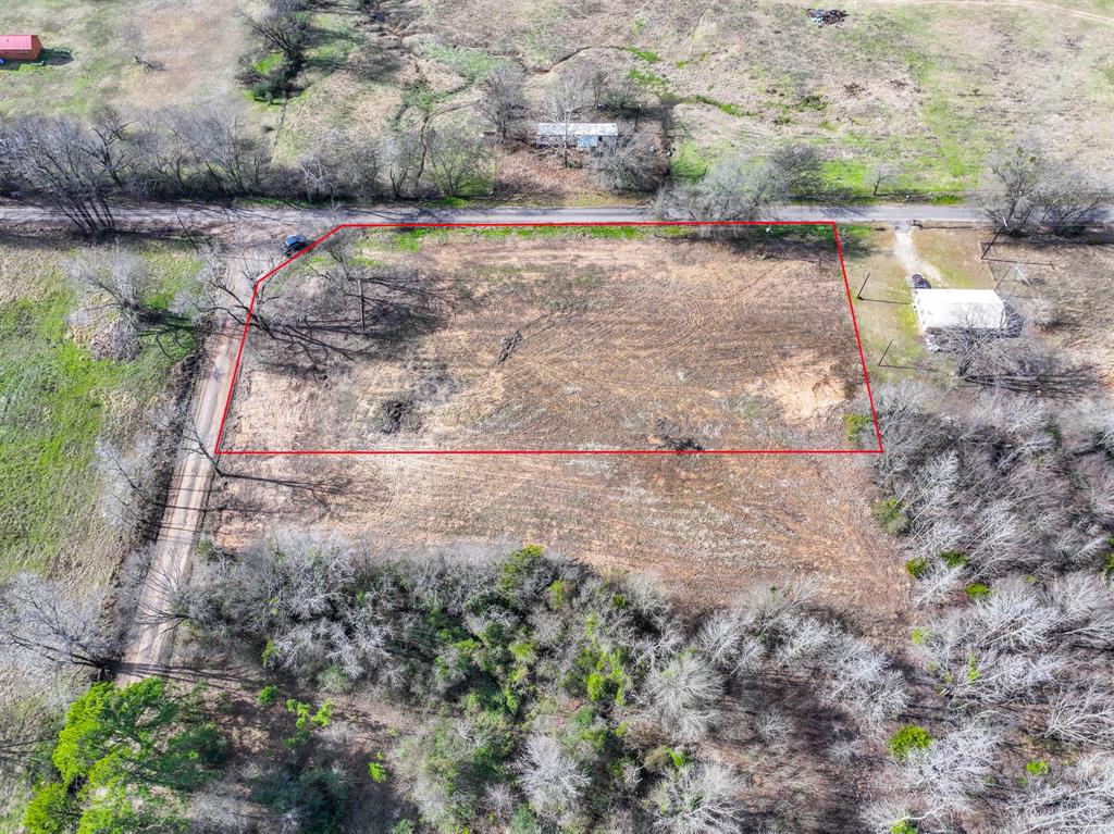 705 County Road 2437 Como, TX 75431 - Photo 6 of 16 a view of a yard with wooden fence