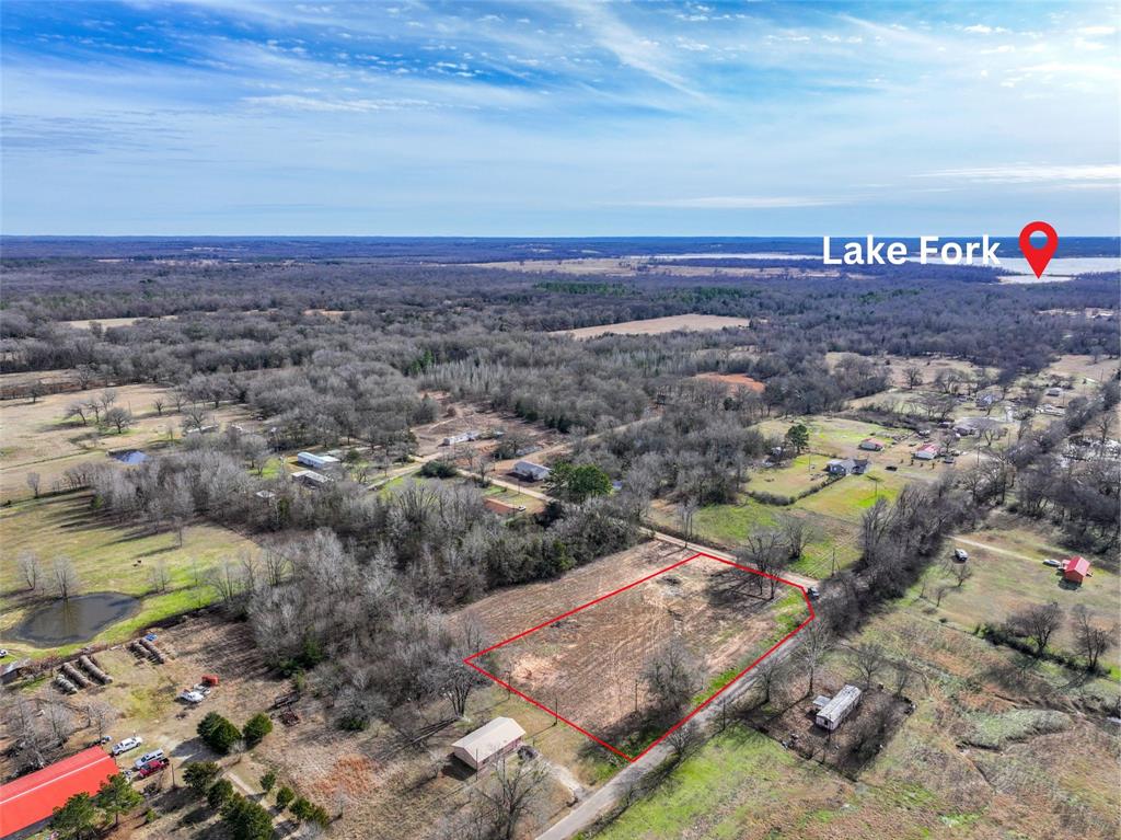705 County Road 2437 Como, TX 75431 - Photo 9 of 16 an aerial view of a house with a garden