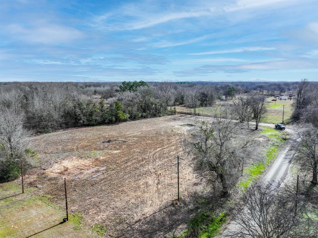 705 County Road 2437 Como, TX 75431 - Photo 10 of 16 a view of a dry yard with wooden fence