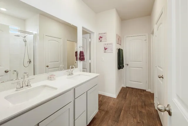 a bathroom with a sink and a mirror