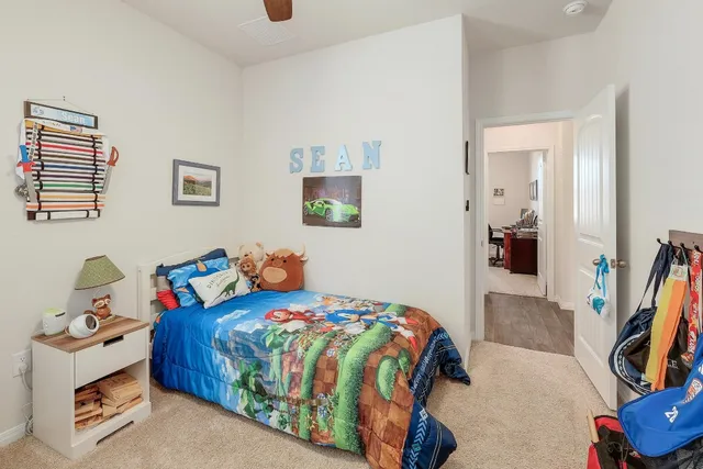 a bedroom with a bed and a couch