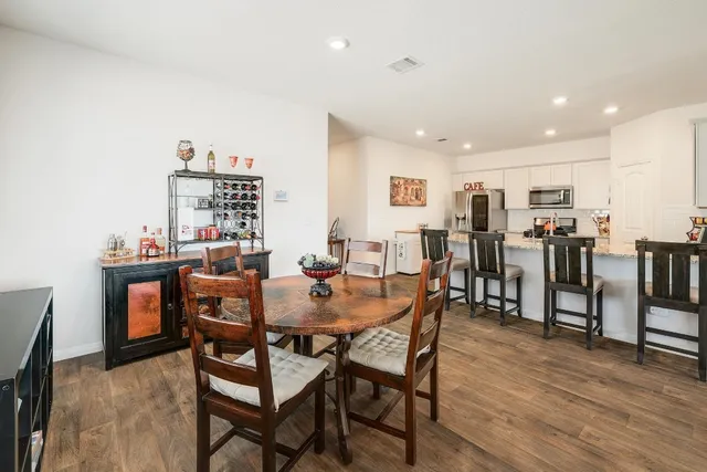 a view of a dining room with furniture