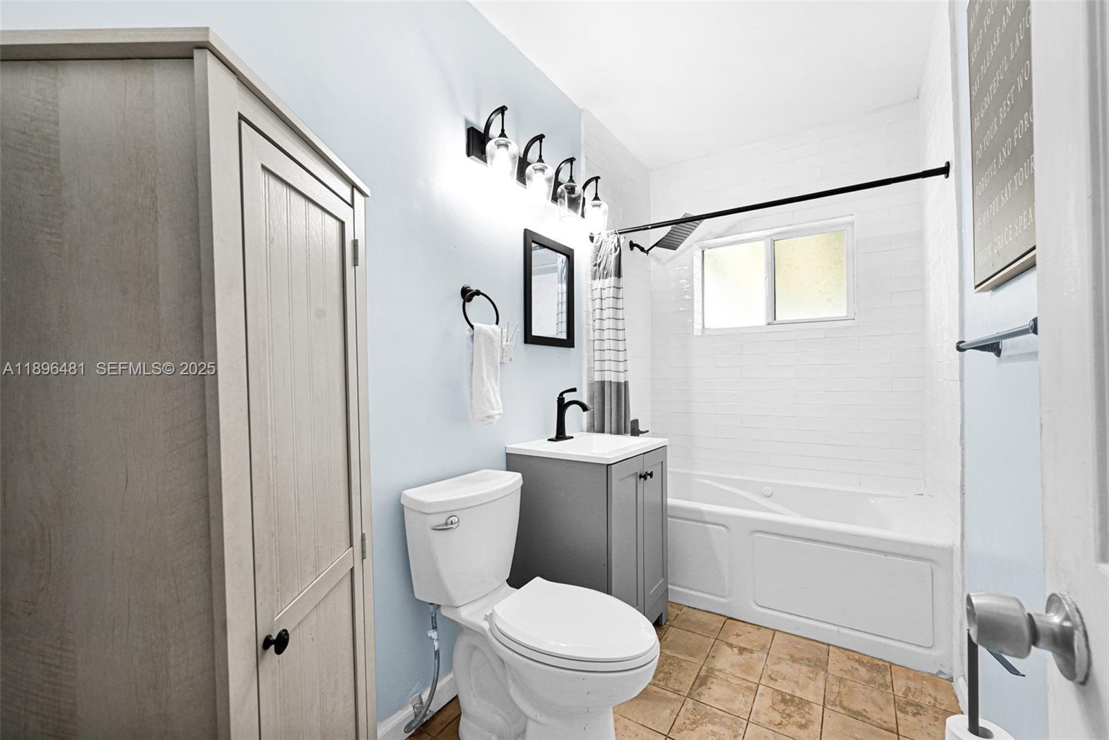 9740 Cutler Ridge Drive Cutler Bay, FL 33157 - Photo 11 of 21 a white toilet sitting next to a bath tub