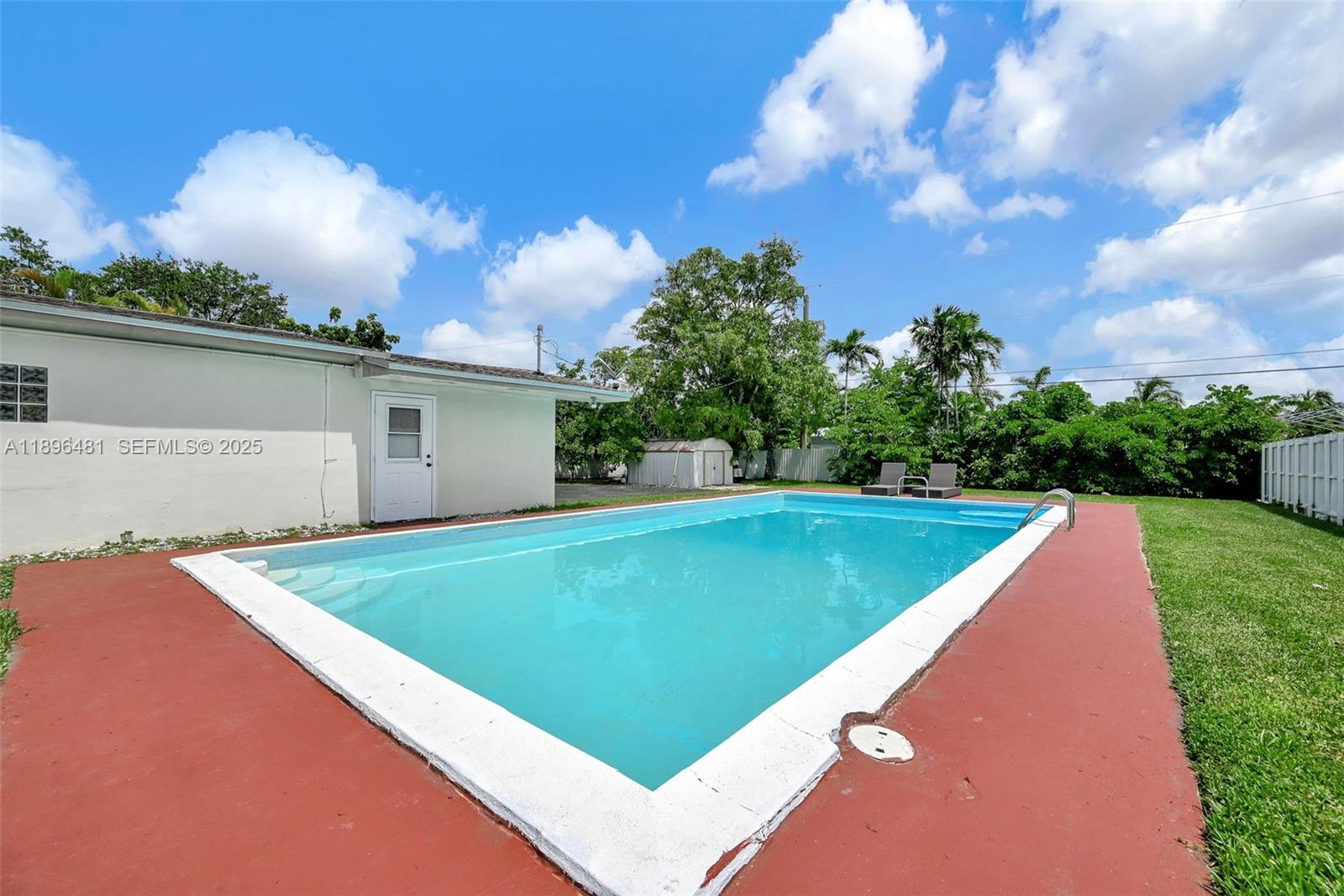 9740 Cutler Ridge Drive Cutler Bay, FL 33157 - Photo 16 of 21 a view of a backyard with swimming pool