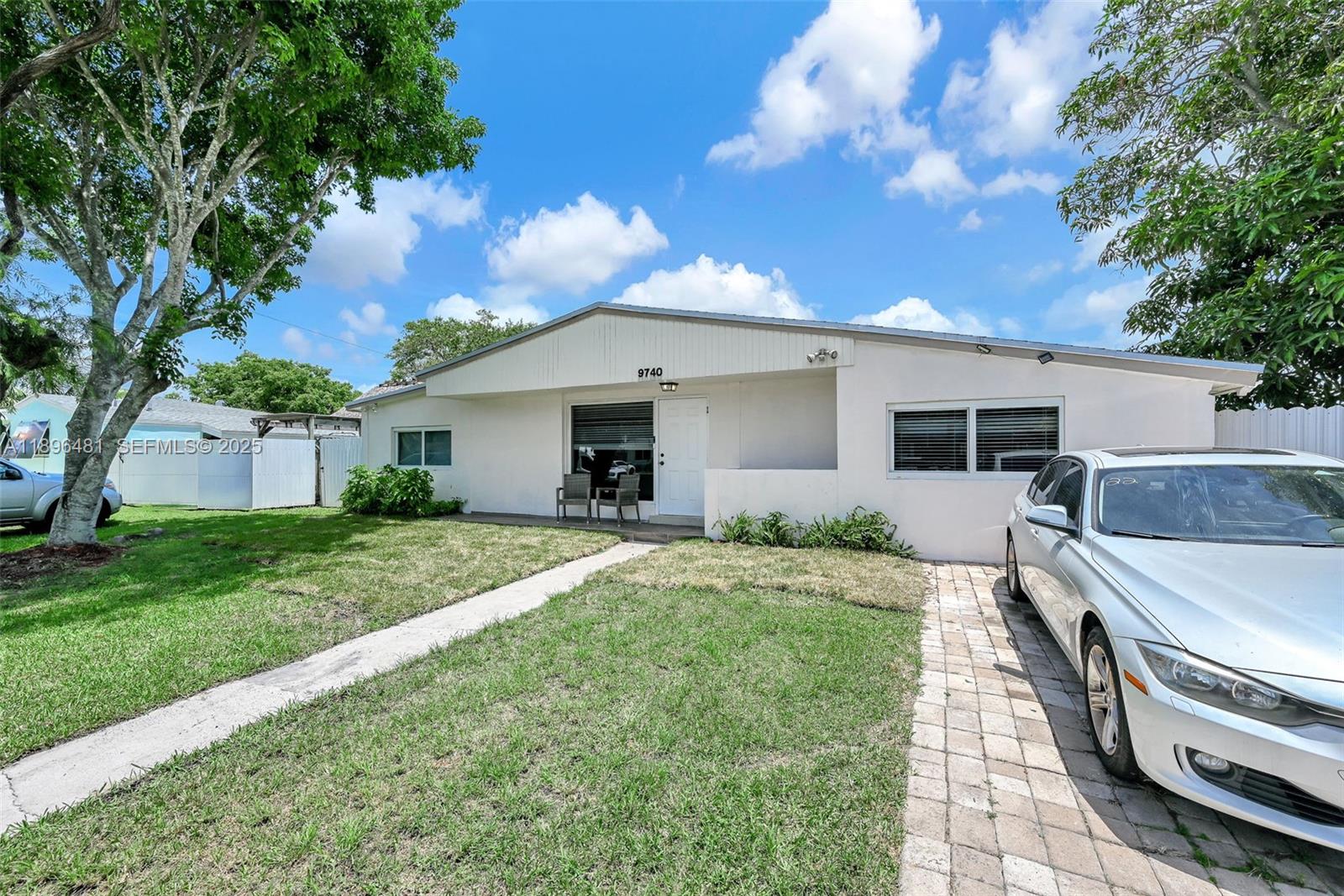 9740 Cutler Ridge Drive Cutler Bay, FL 33157 - Photo 2 of 21 a front view of house with yard and trees