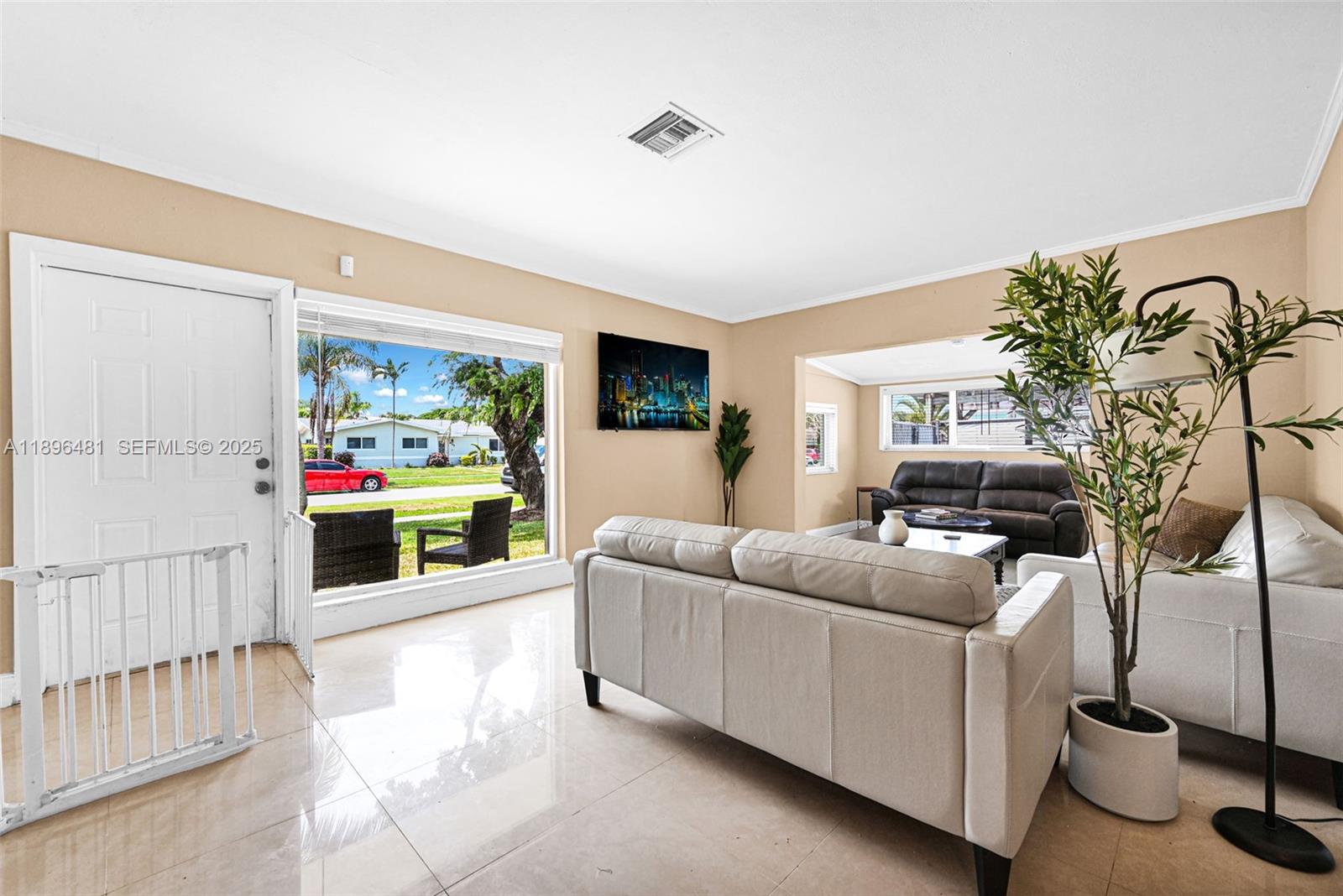 9740 Cutler Ridge Drive Cutler Bay, FL 33157 - Photo 5 of 21 a living room with furniture and a flat screen tv