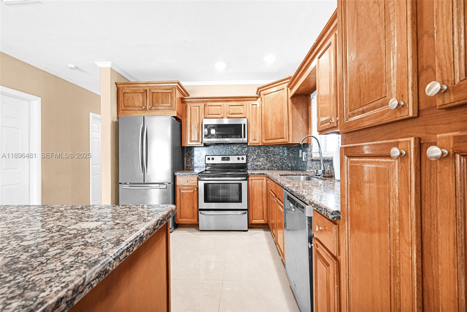 9740 Cutler Ridge Drive Cutler Bay, FL 33157 - Photo 8 of 21 a kitchen with stainless steel appliances granite countertop a refrigerator and a stove top oven