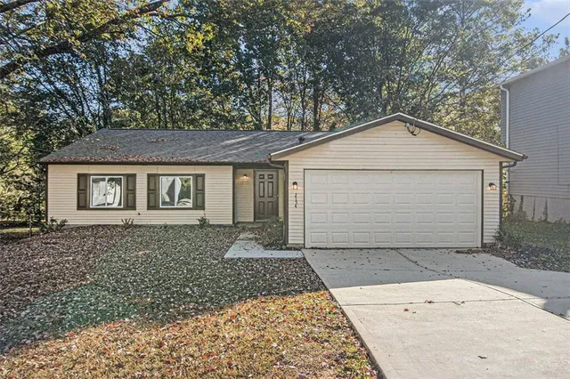 front view of a house with a yard