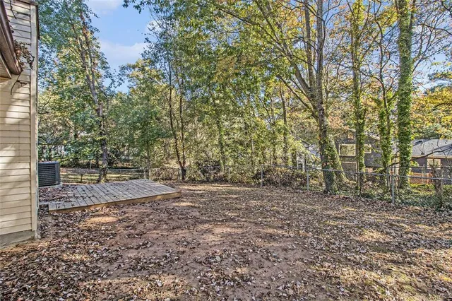 a view of a yard with trees