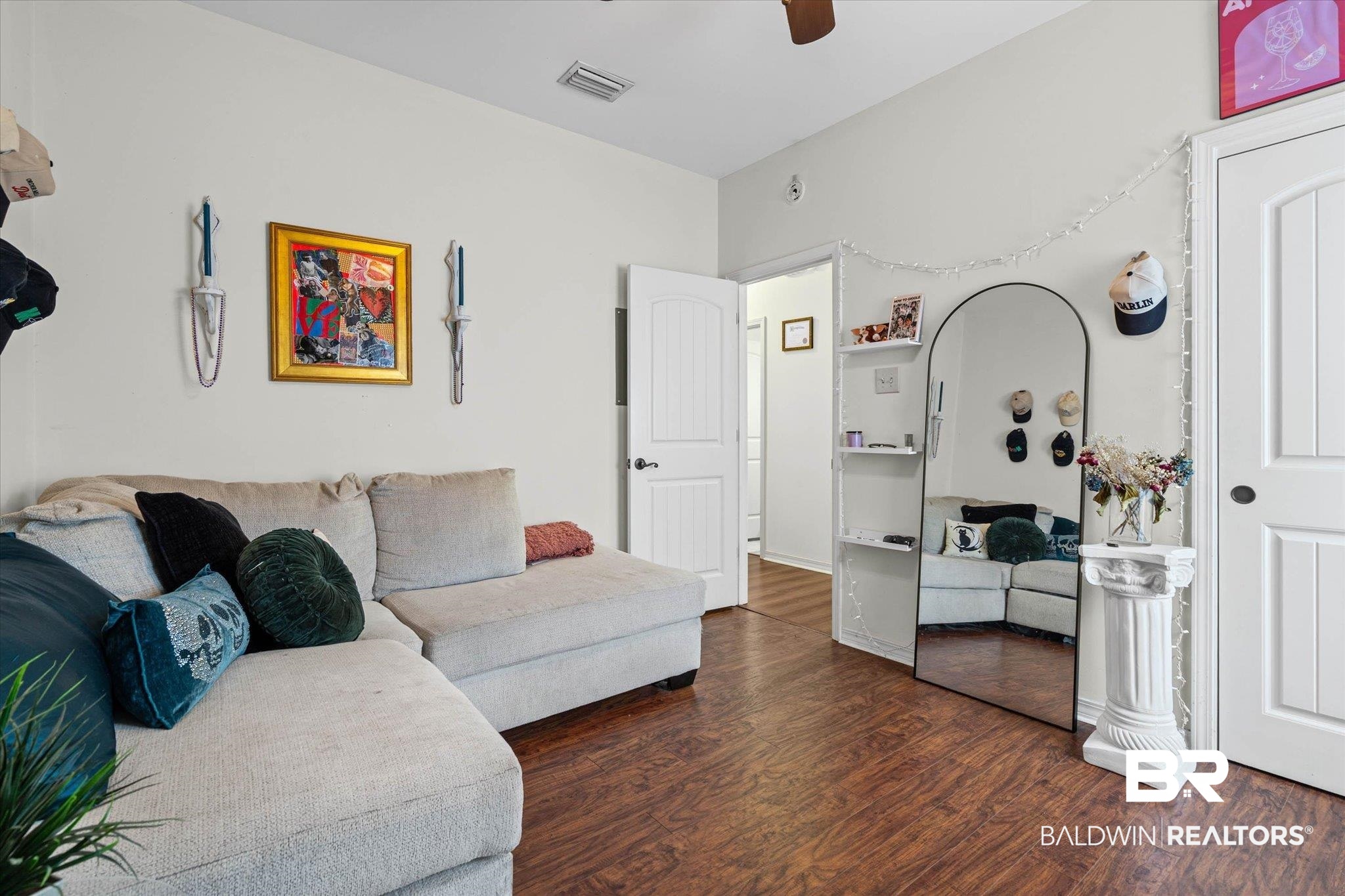 800 Galoway Avenue Mobile, AL 36609 - Photo 15 of 22 Spacious interior room featuring wood-finish flooring, light-toned walls, and a ceiling fan